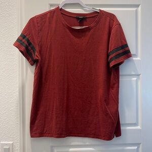 Orangey too with black stripes at the arm